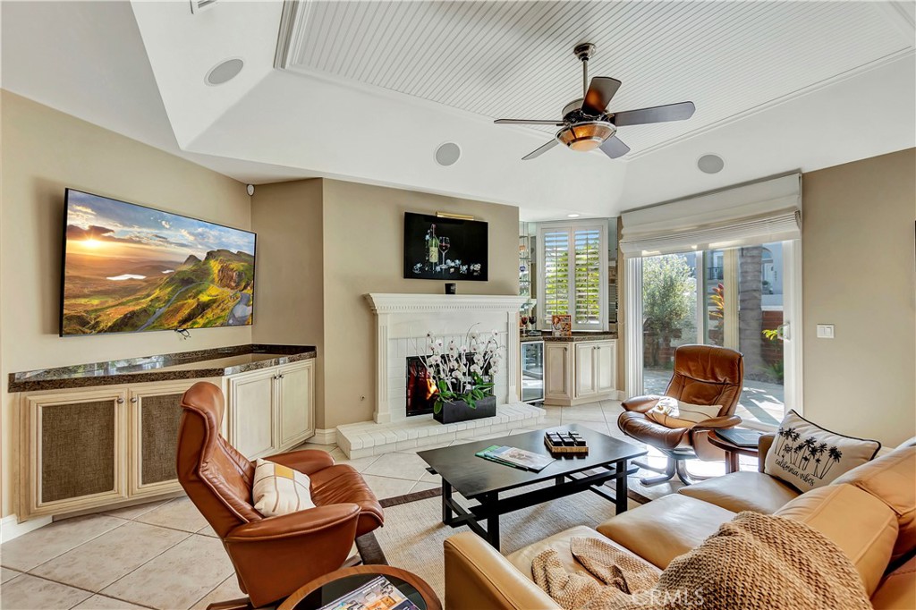 6096 Eaglecrest Drive Huntington Beach, CA 92648 - Photo 22 of 64 a living room with fireplace furniture and a flat screen tv