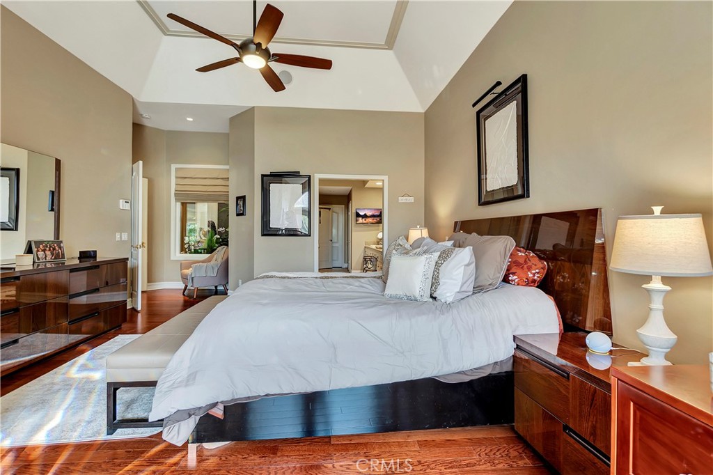 6096 Eaglecrest Drive Huntington Beach, CA 92648 - Photo 30 of 64 a bedroom with a bed and wooden floor