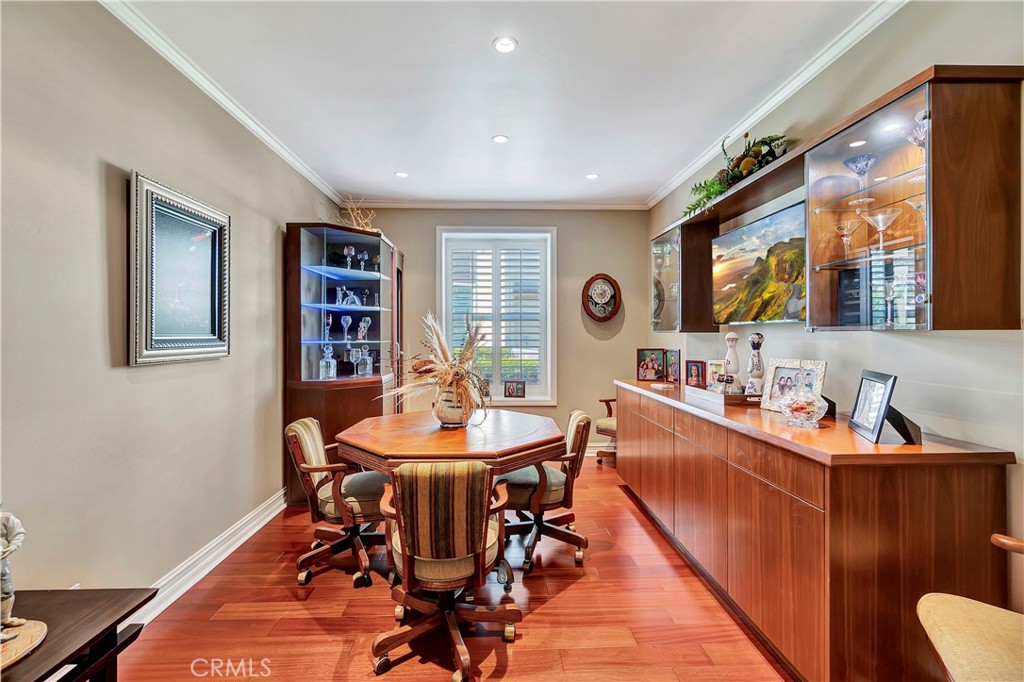6096 Eaglecrest Drive Huntington Beach, CA 92648 - Photo 39 of 64 a view of a dining room with furniture window and wooden floor