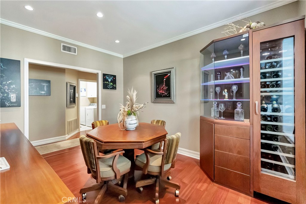 6096 Eaglecrest Drive Huntington Beach, CA 92648 - Photo 40 of 64 a view of a dining room with furniture and wooden floor