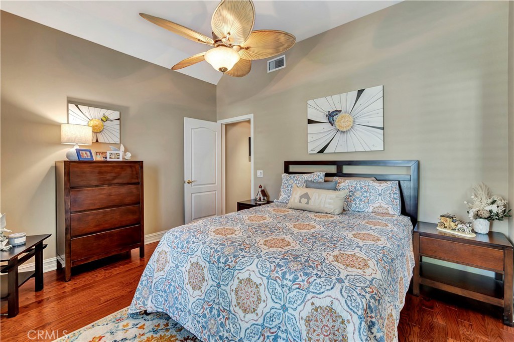 6096 Eaglecrest Drive Huntington Beach, CA 92648 - Photo 43 of 64 a bedroom with a bed and a chandelier