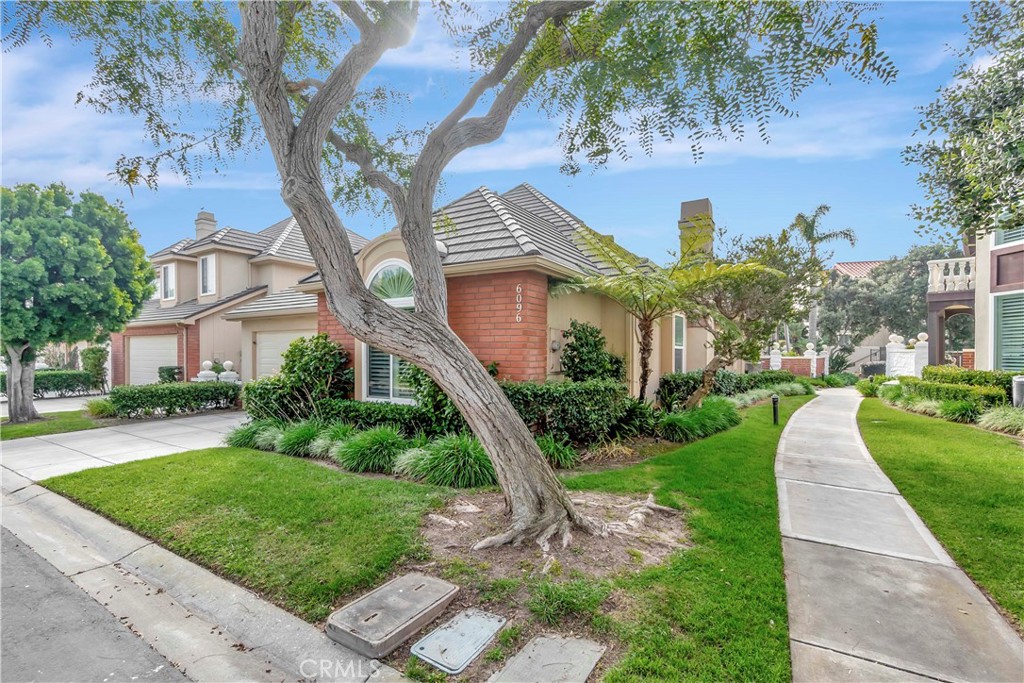 6096 Eaglecrest Drive Huntington Beach, CA 92648 - Photo 46 of 64 a front view of a house with a yard