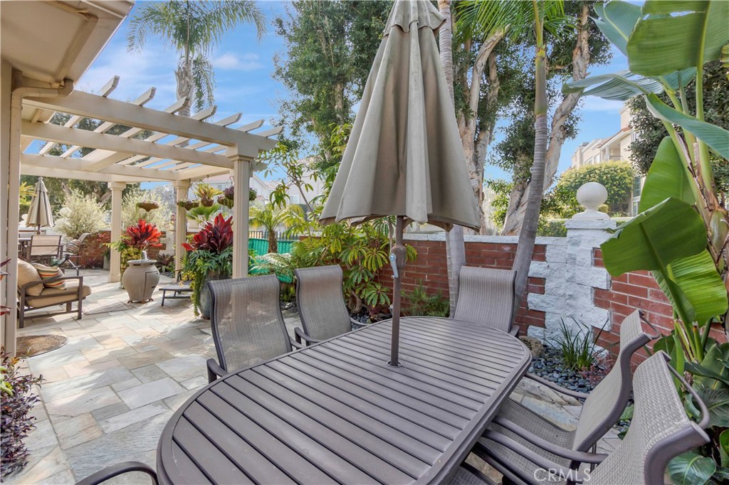 6096 Eaglecrest Drive Huntington Beach, CA 92648 - Photo 47 of 64 a view of a chairs and tables in patio