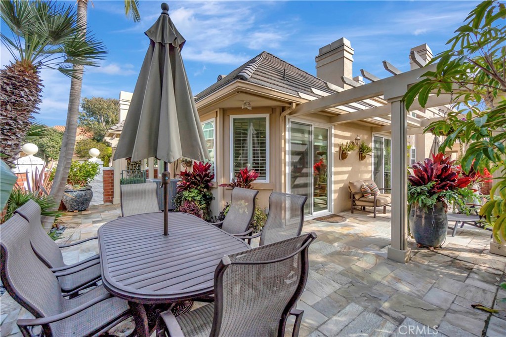 6096 Eaglecrest Drive Huntington Beach, CA 92648 - Photo 48 of 64 a view of a house with a wooden deck and a swimming pool