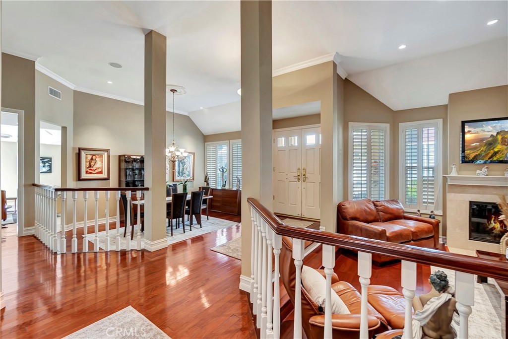 6096 Eaglecrest Drive Huntington Beach, CA 92648 - Photo 6 of 64 a dining room filled with furniture and wooden floor