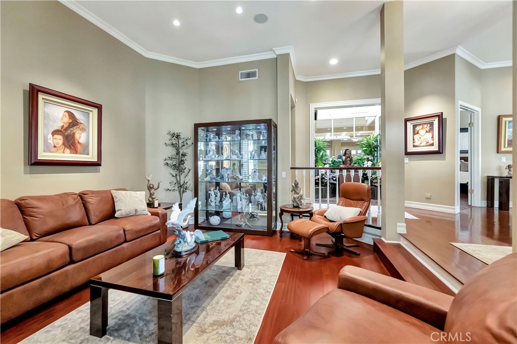 6096 Eaglecrest Drive Huntington Beach, CA 92648 - Photo 10 of 64 a living room with furniture rug and wooden floor