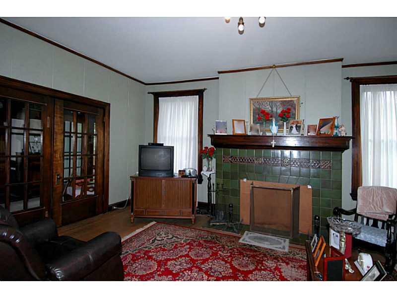 700 Delafield Road Fox Chapel, PA 15215 - Photo 8 of 23 Living Room. Log burning fire place in living room. The French doors to the left lead to the den.