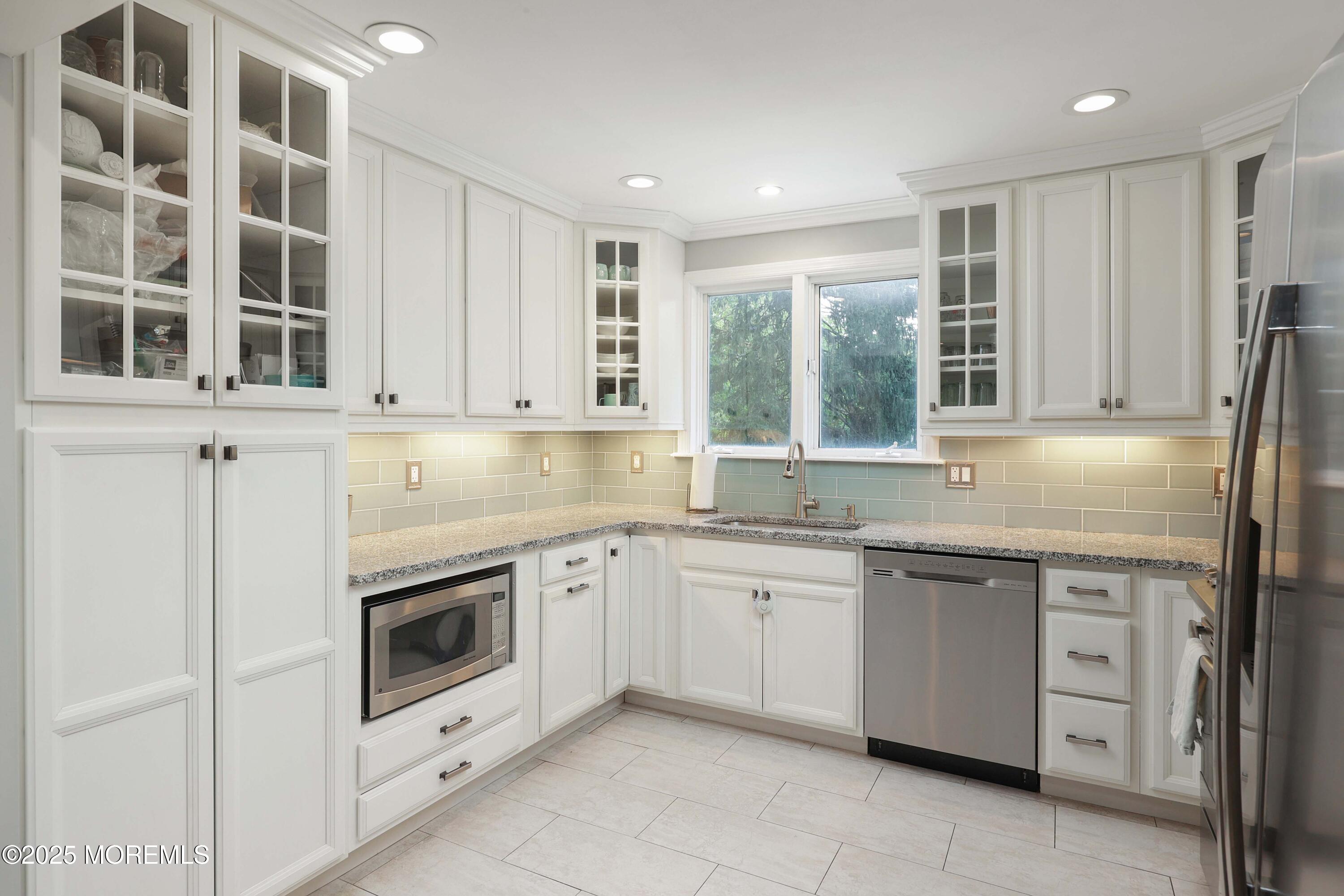 29 Lake Boulevard Matawan, NJ 07747 - Photo 11 of 39 a kitchen that has a sink and a stove in it