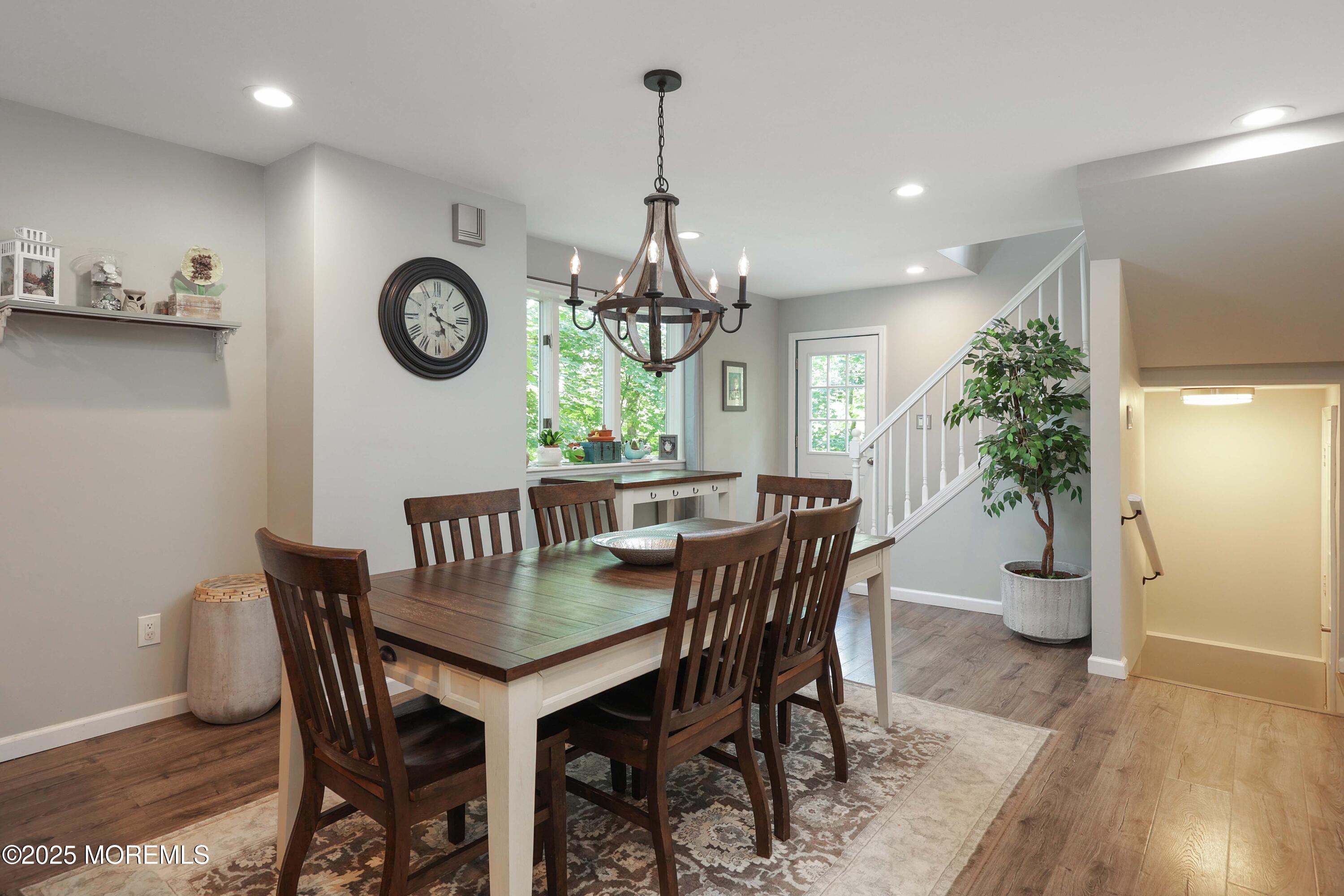 29 Lake Boulevard Matawan, NJ 07747 - Photo 15 of 39 a dining room with furniture a potted plant and wooden floor