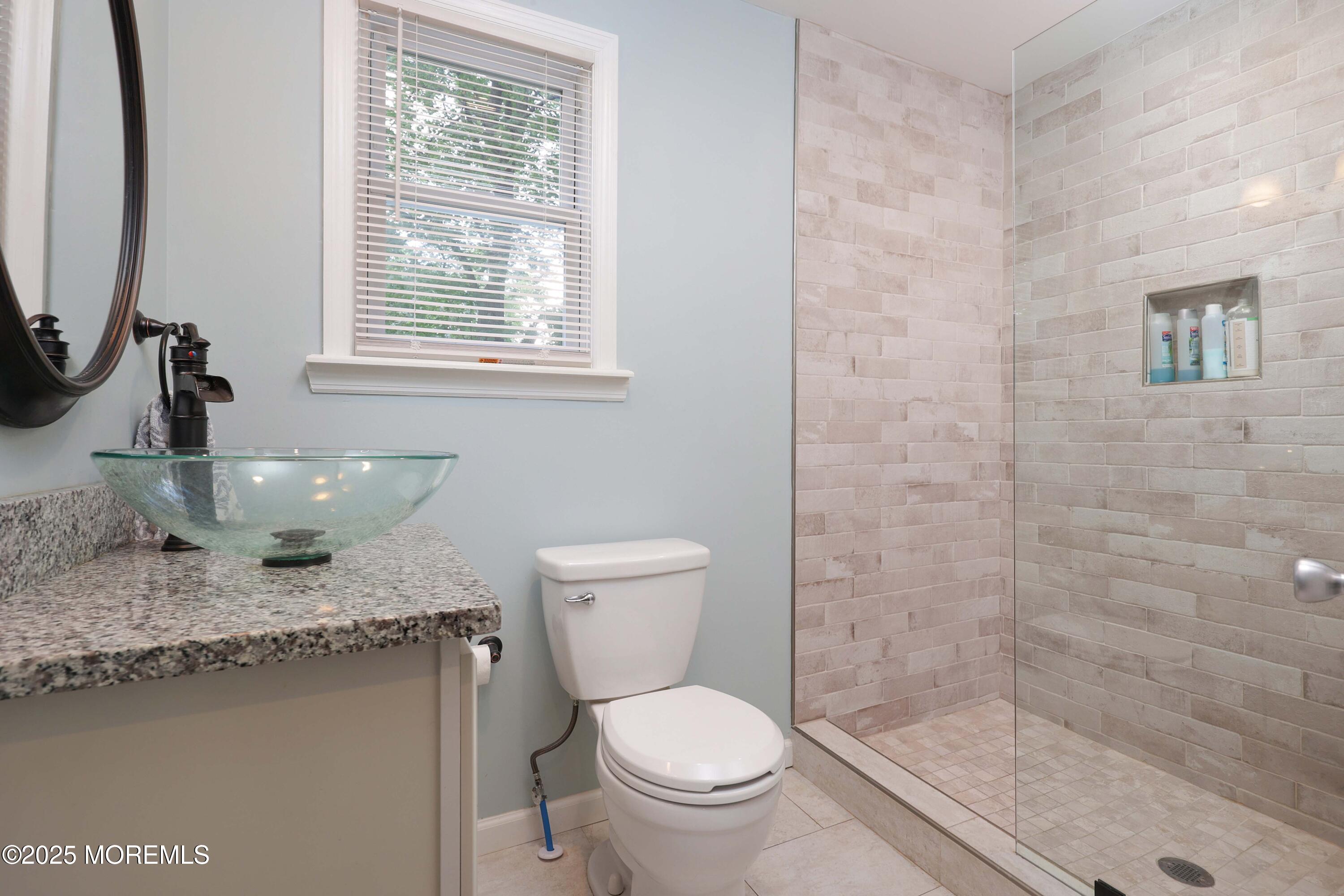 29 Lake Boulevard Matawan, NJ 07747 - Photo 17 of 39 a bathroom with a granite countertop toilet sink and mirror