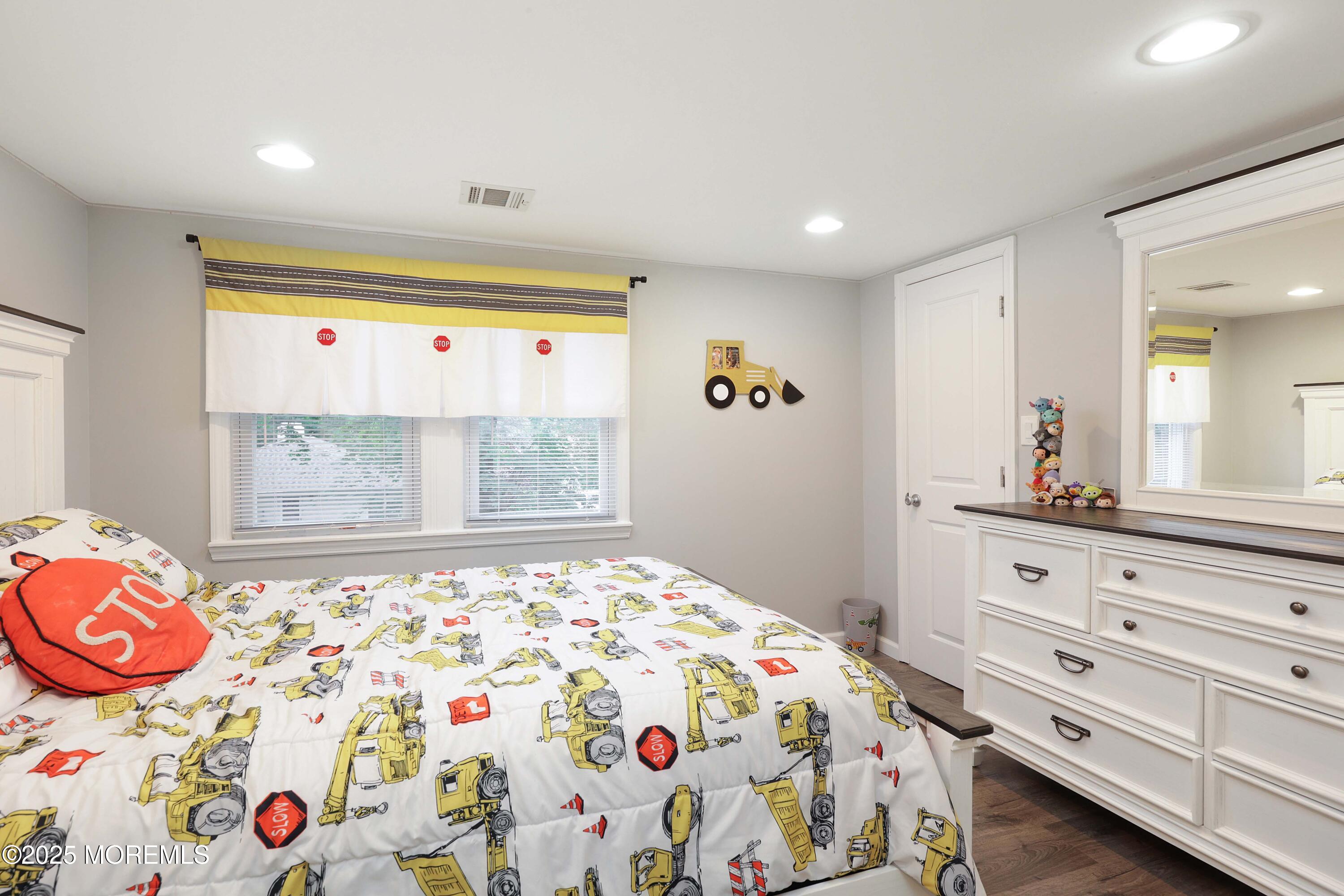 29 Lake Boulevard Matawan, NJ 07747 - Photo 19 of 39 a bedroom with a bed and a dresser in it