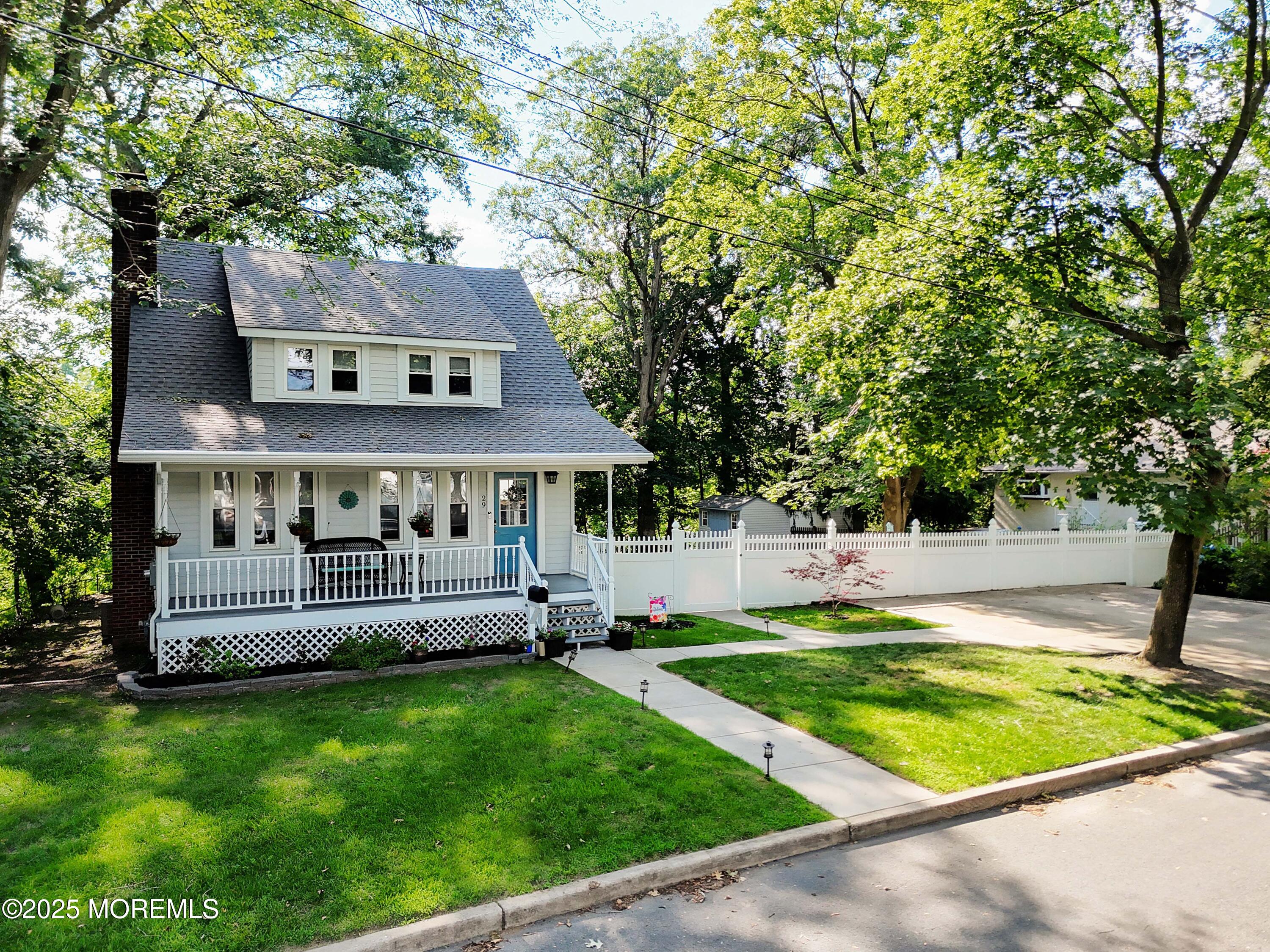29 Lake Boulevard Matawan, NJ 07747 - Photo 2 of 39 a view of a house with pool and a yard