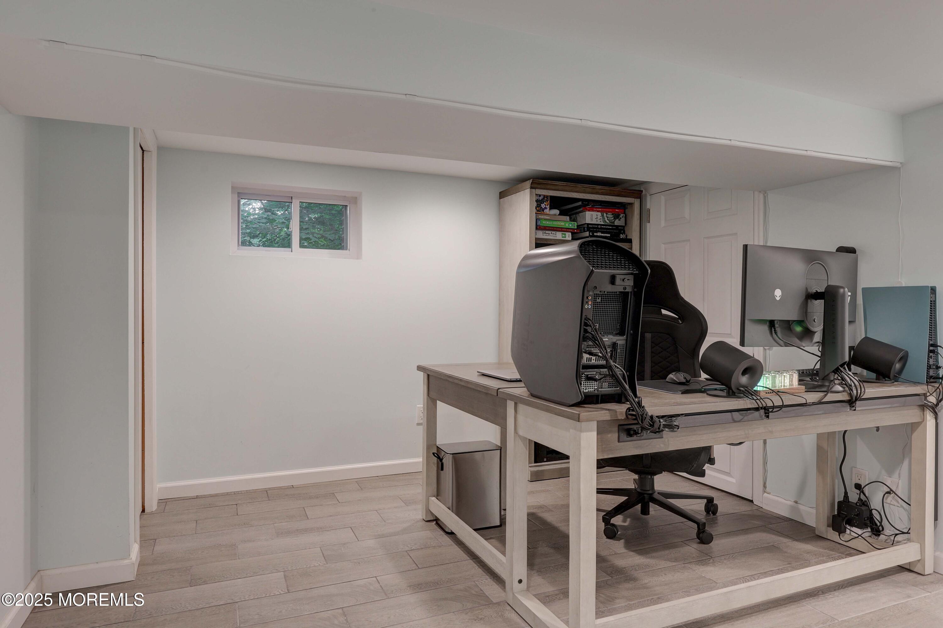 29 Lake Boulevard Matawan, NJ 07747 - Photo 25 of 39 a view of a workspace with furniture and gym equipment