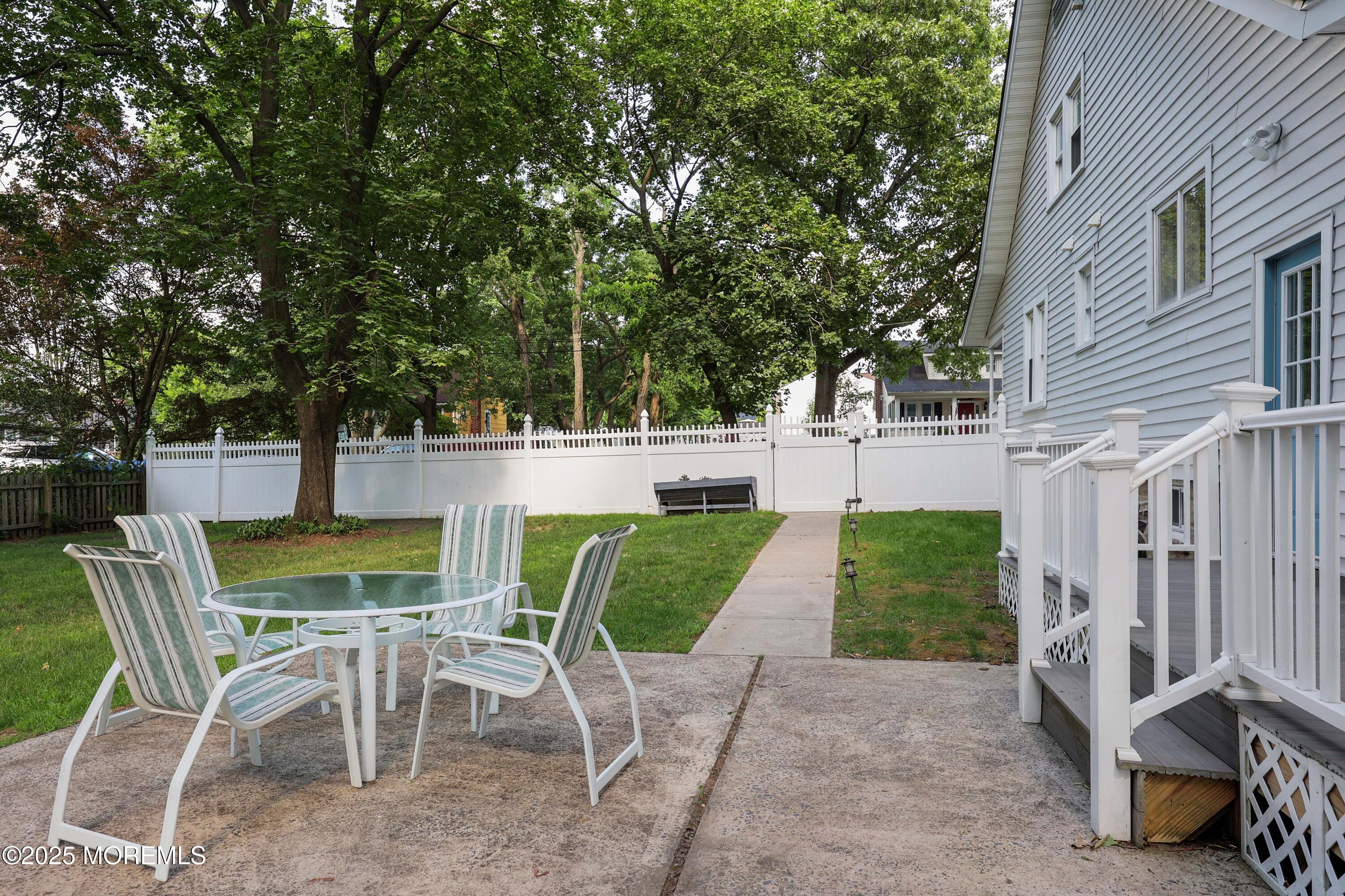 29 Lake Boulevard Matawan, NJ 07747 - Photo 28 of 39 a view of a chairs and table in backyard