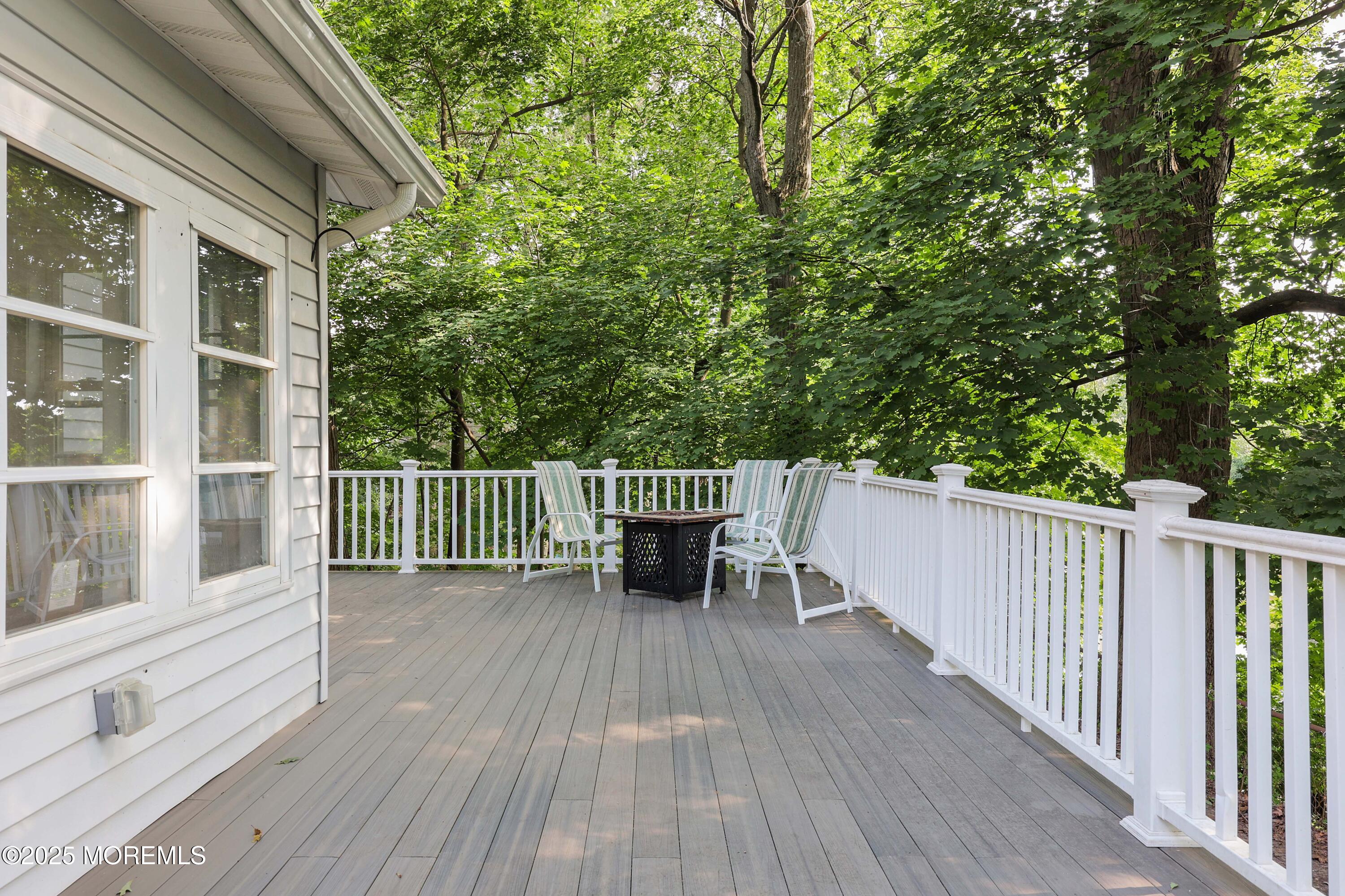29 Lake Boulevard Matawan, NJ 07747 - Photo 30 of 39 a balcony with wooden floor and fence