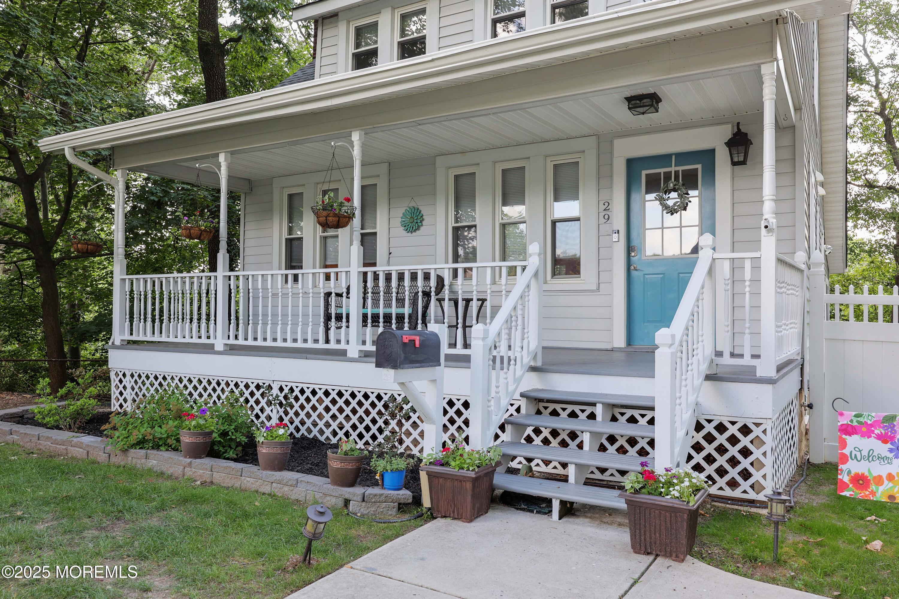 29 Lake Boulevard Matawan, NJ 07747 - Photo 3 of 39 front view of a house with a small yard and wooden fence
