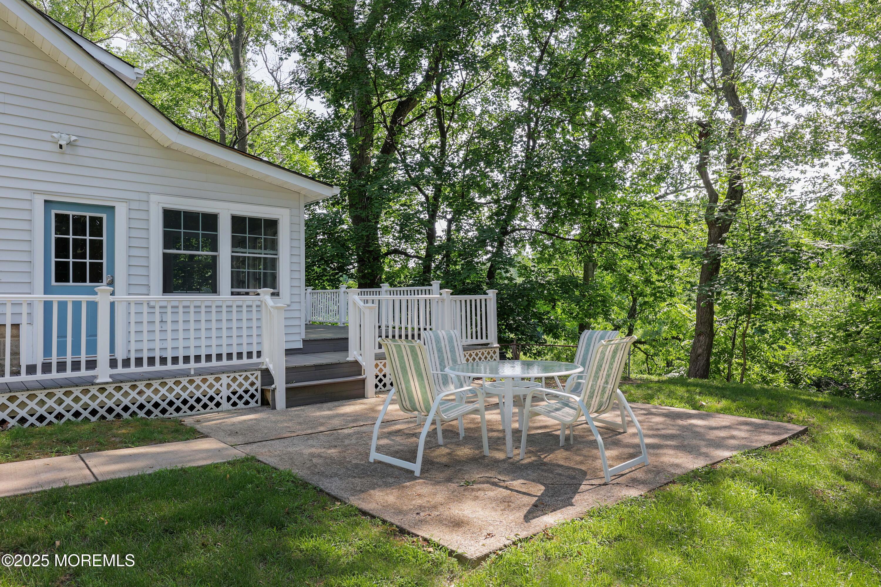 29 Lake Boulevard Matawan, NJ 07747 - Photo 31 of 39 a view of a chair and table in backyard of the house