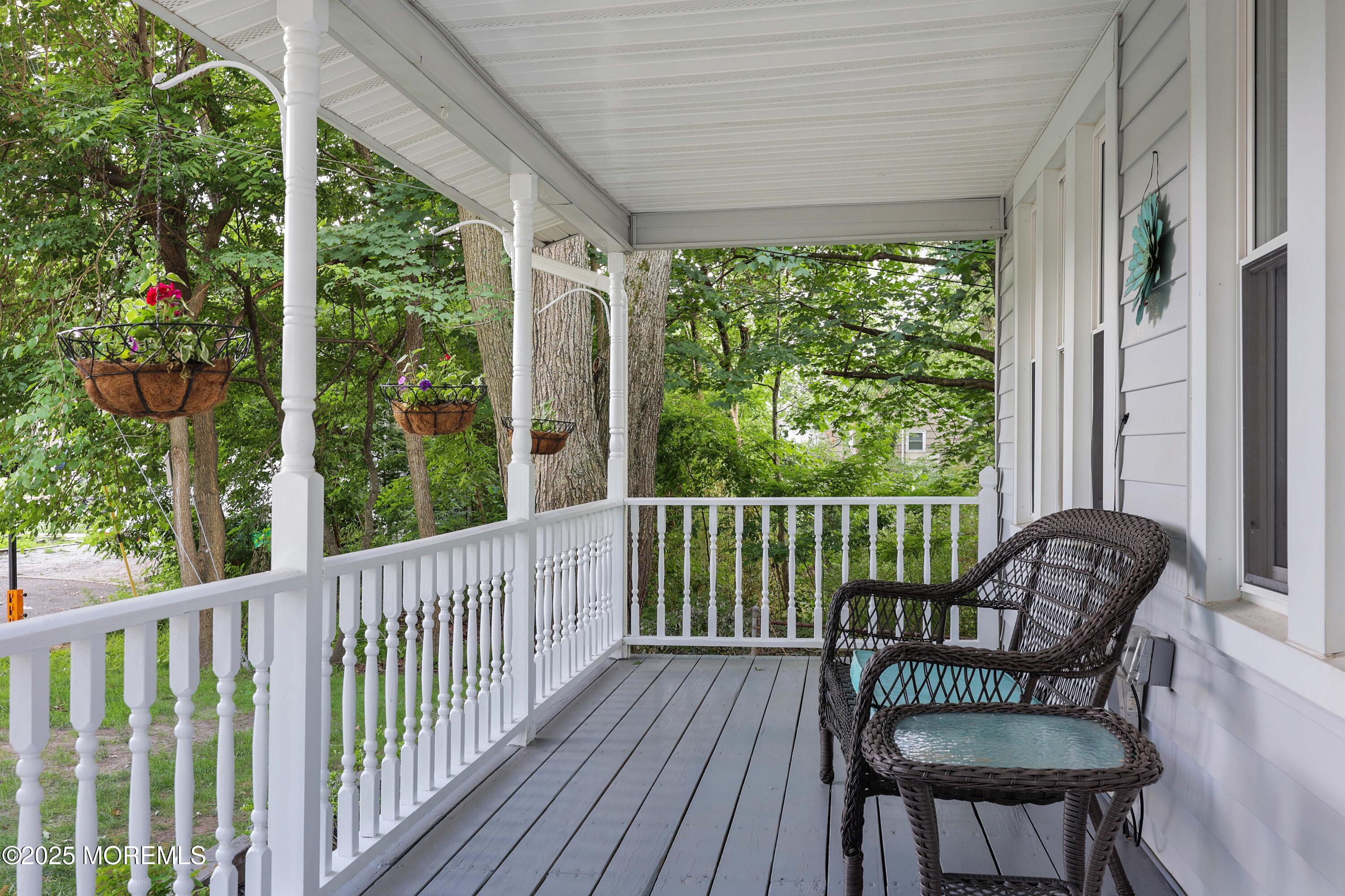 29 Lake Boulevard Matawan, NJ 07747 - Photo 4 of 39 a view of a chair in wooden deck