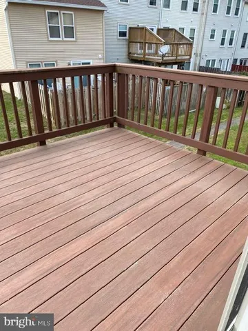 a balcony with wooden floor