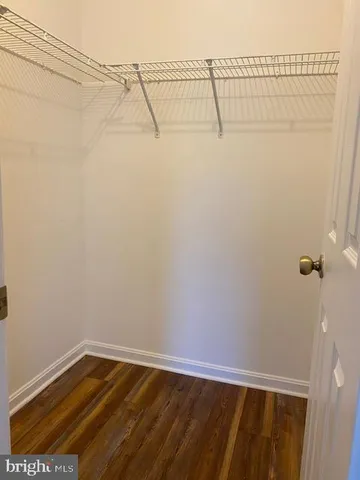 a white toilet sitting next to a shower