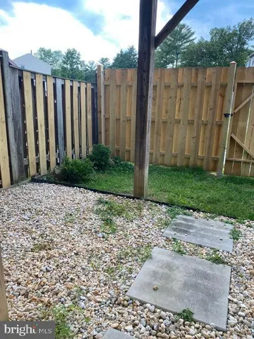 a view of a wooden door with a yard