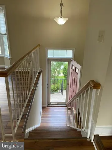 a view of entryway with wooden floor