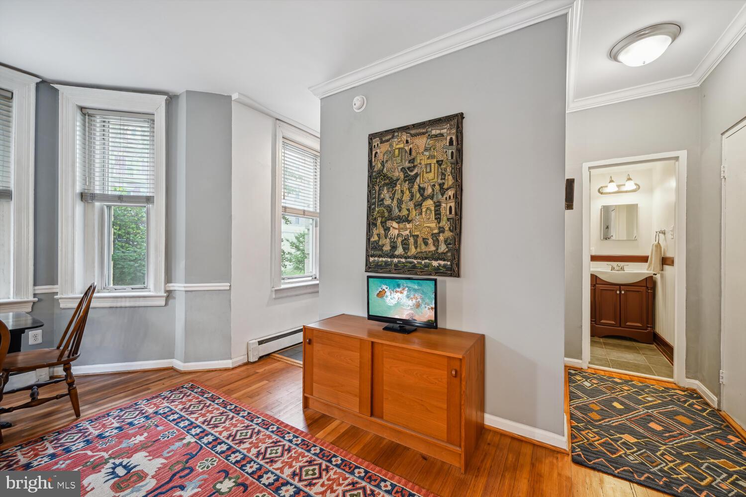 1831 Belmont Road Northwest, Unit 201 Washington, DC 20009 - Photo 4 of 11 a living room with furniture and a window