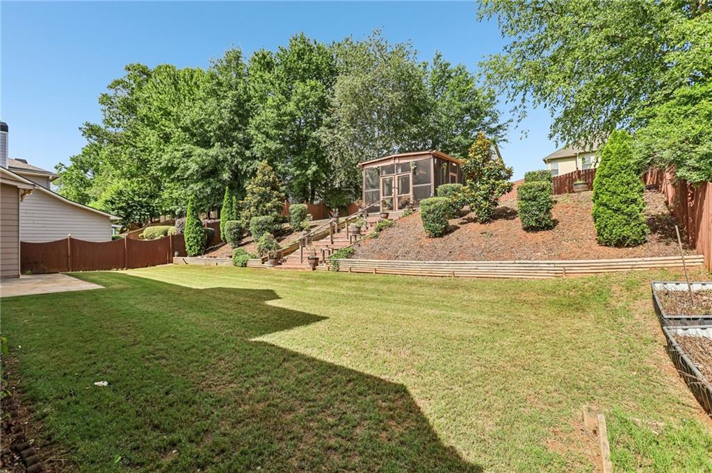 810 Freedom Way Cumming, GA 30040 - Photo 44 of 61 a view of a house with a yard