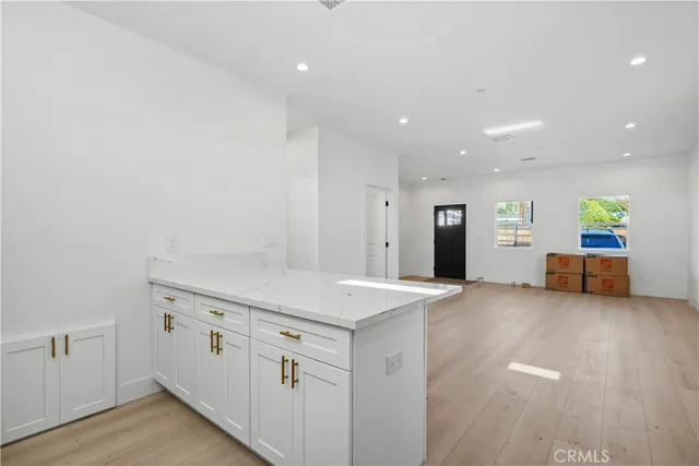 a view of a kitchen with a sink