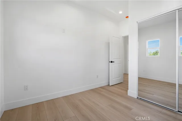 an empty room with wooden floor