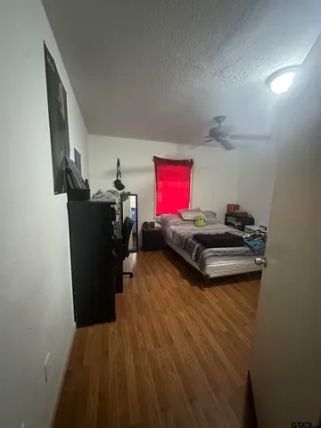 a view of a workspace with furniture and wooden floor