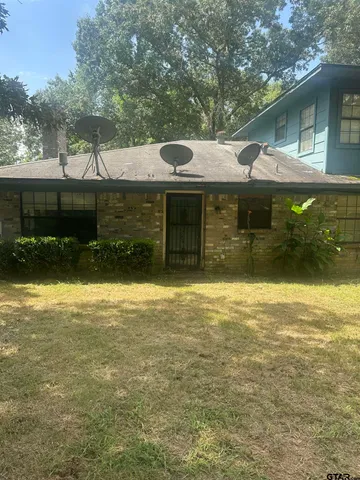 a view of a table and chairs in the patio