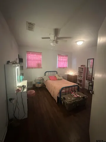 a bedroom with a bed and furniture