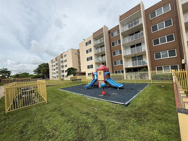 a view of outdoor space with swimming pool and sitting space
