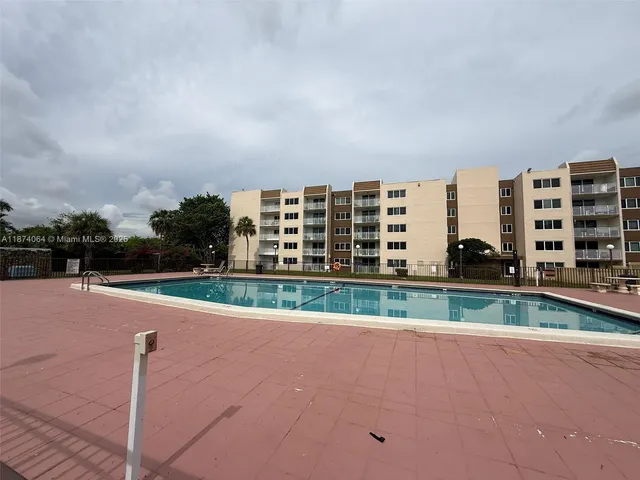 a view of swimming pool from a balcony