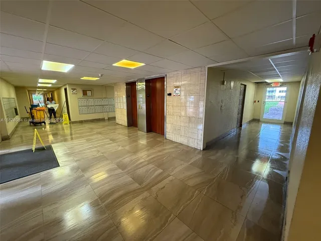 a view of a hallway with a room