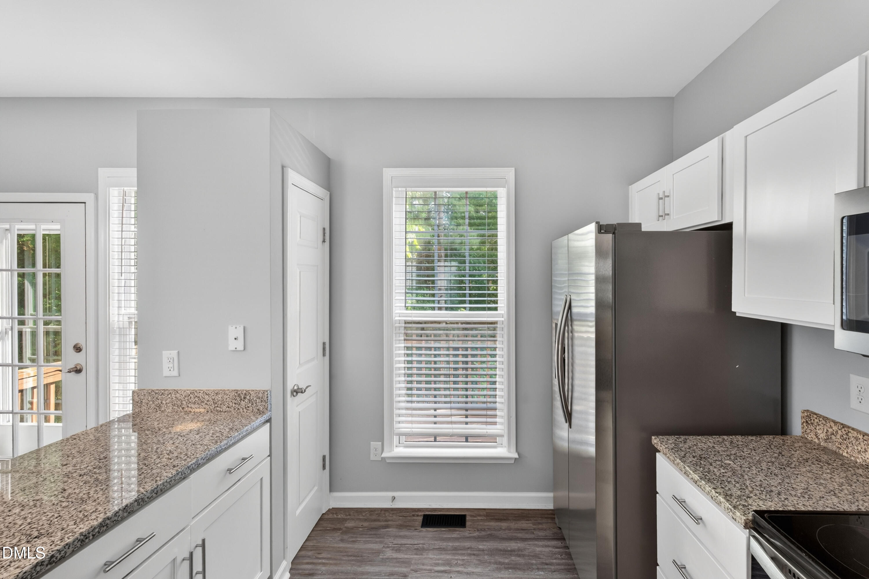 5421 Golden Arrow Lane Raleigh, NC 27613 - Photo 21 of 49 a kitchen with stainless steel appliances granite countertop a refrigerator and a sink