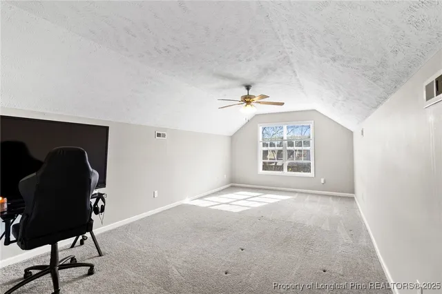 a view of livingroom with furniture and window