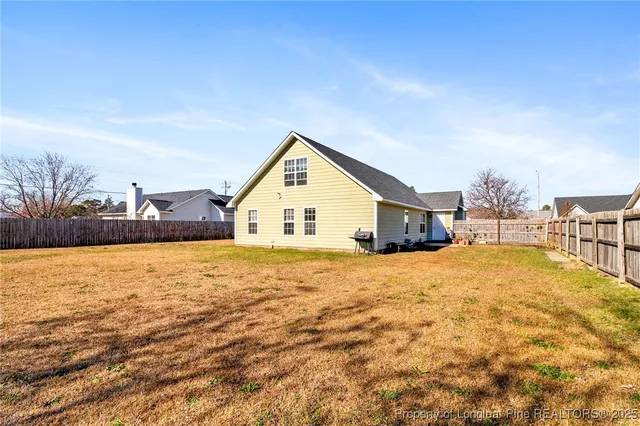 a view of a kitchen with a sink and a chair