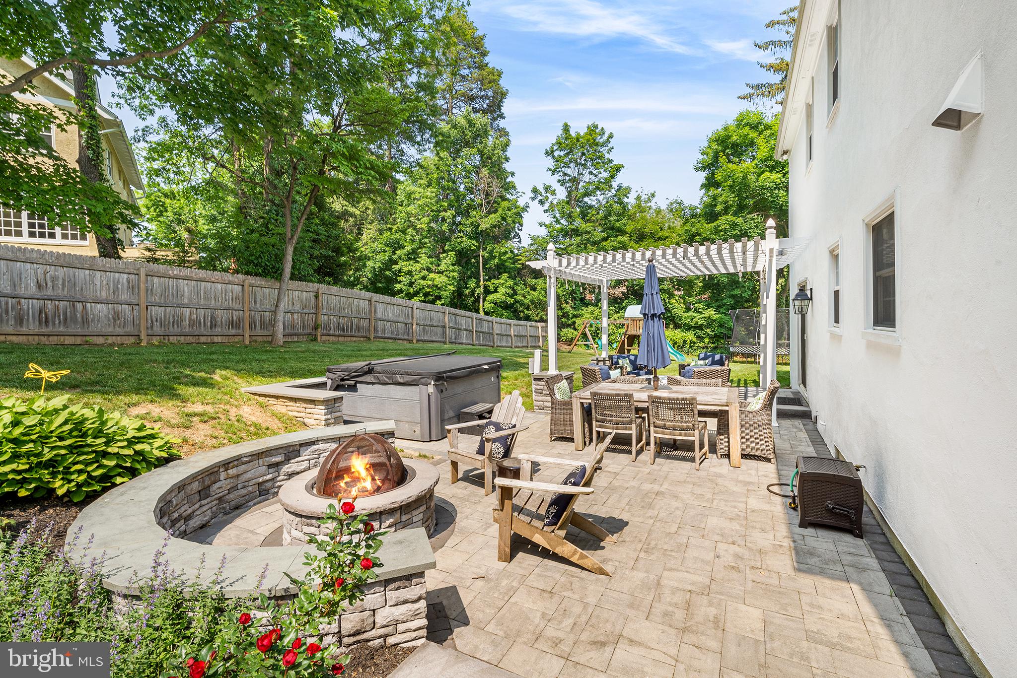 301 Orchard Way Wayne, PA 19087 - Photo 37 of 48 Patio with wood burning firepit with wall seating