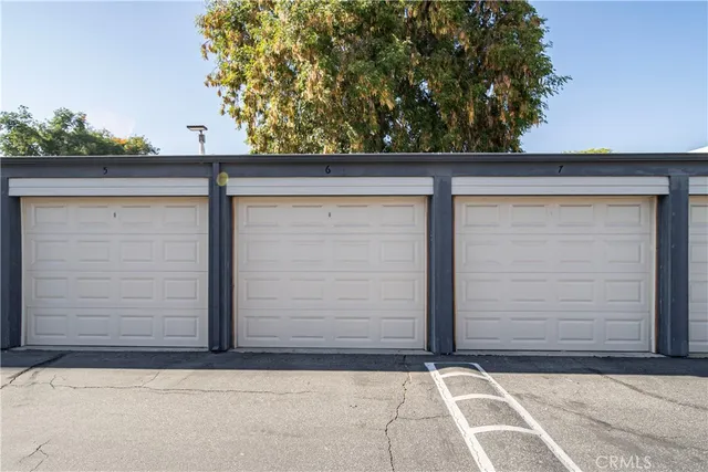 a room with a sink wooden floor and a window
