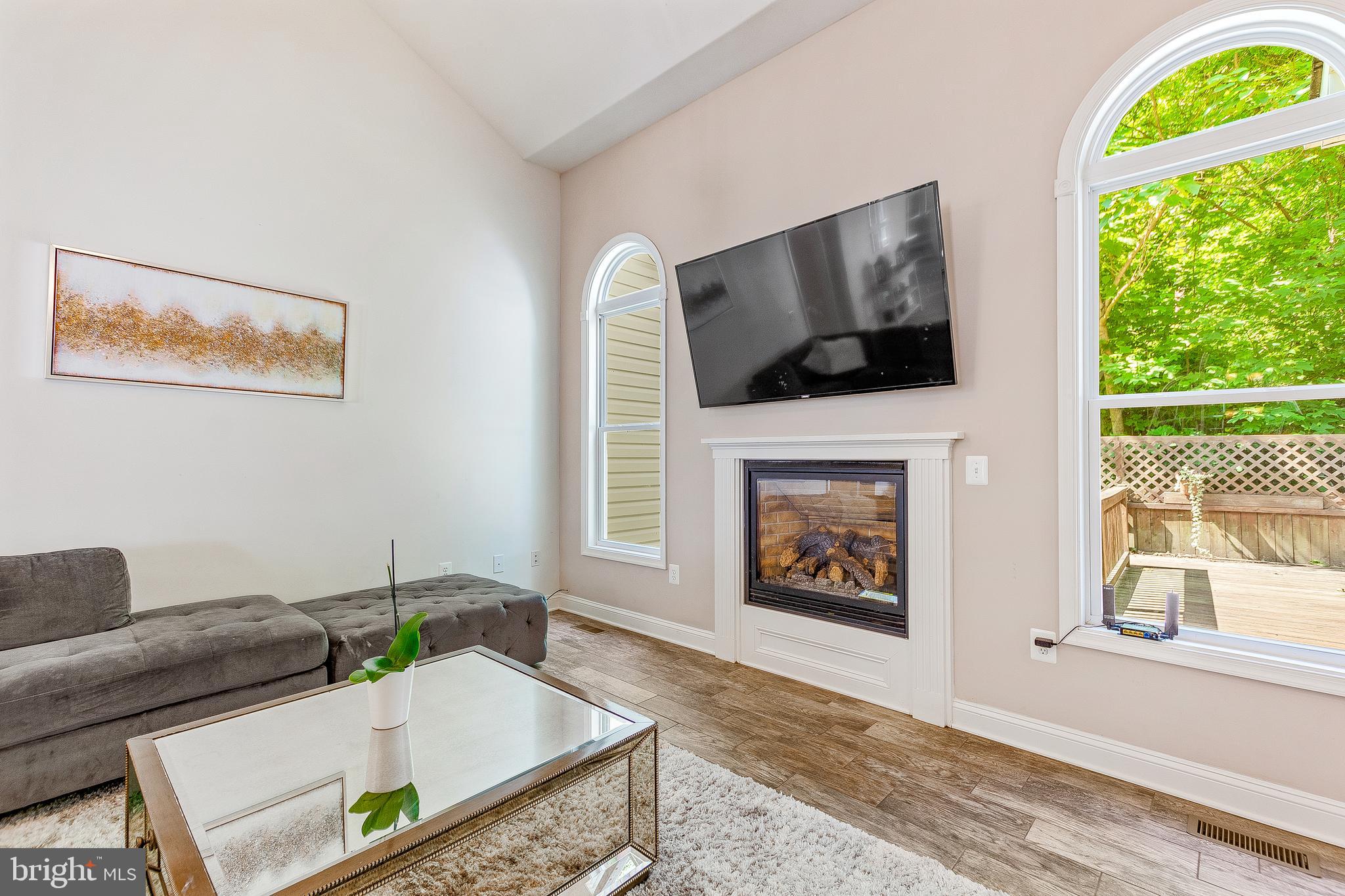 1808 Wilson Road Huntingtown, MD 20639 - Photo 13 of 53 a living room with furniture and a fireplace