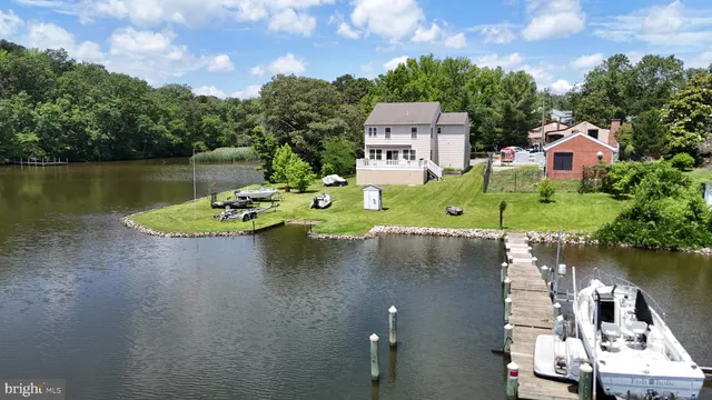 an aerial view of a house with a lake view