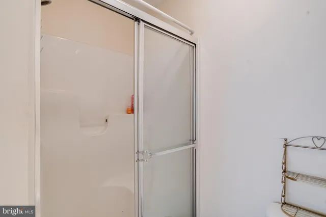 an aerial view of a house with swimming pool patio and lake view