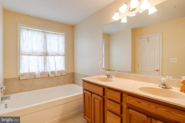 a aerial view of a house with table and chairs