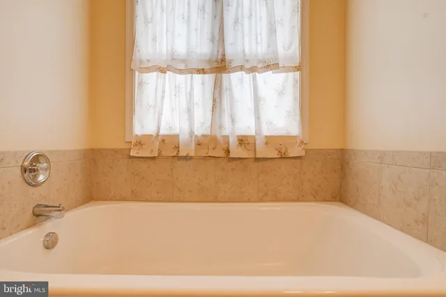 a view of a house with pool and a yard