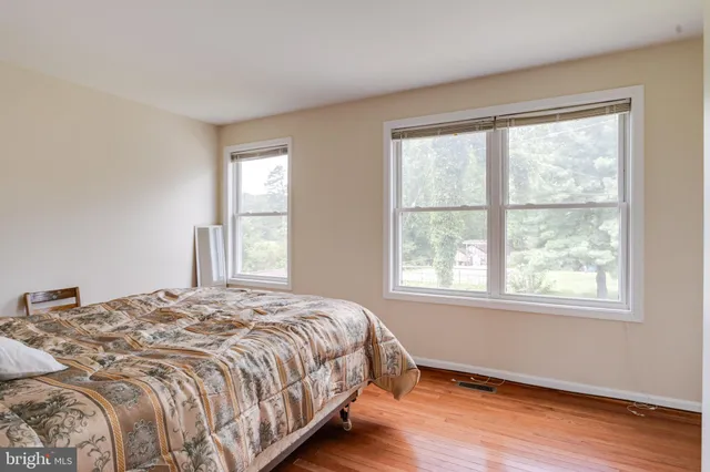 a view of a balcony with wooden floor and lake view