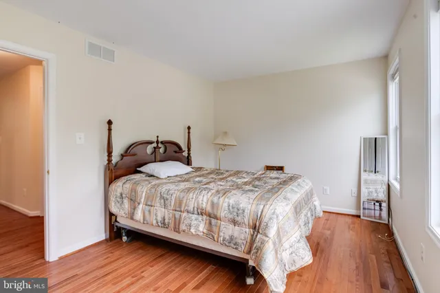 a view of a lake with houses in the back