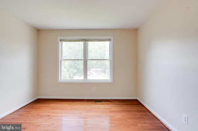 a swimming pool with an outdoor seating and yard