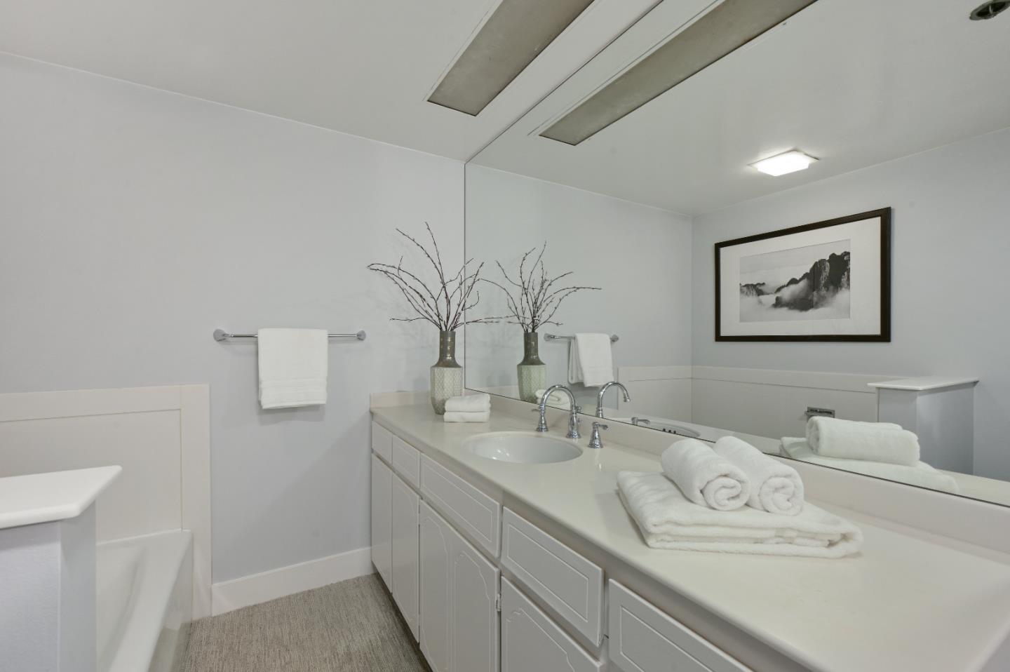 110 Park Road, Unit 502 Burlingame, CA 94010 - Photo 24 of 43 a bathroom with a sink and a mirror